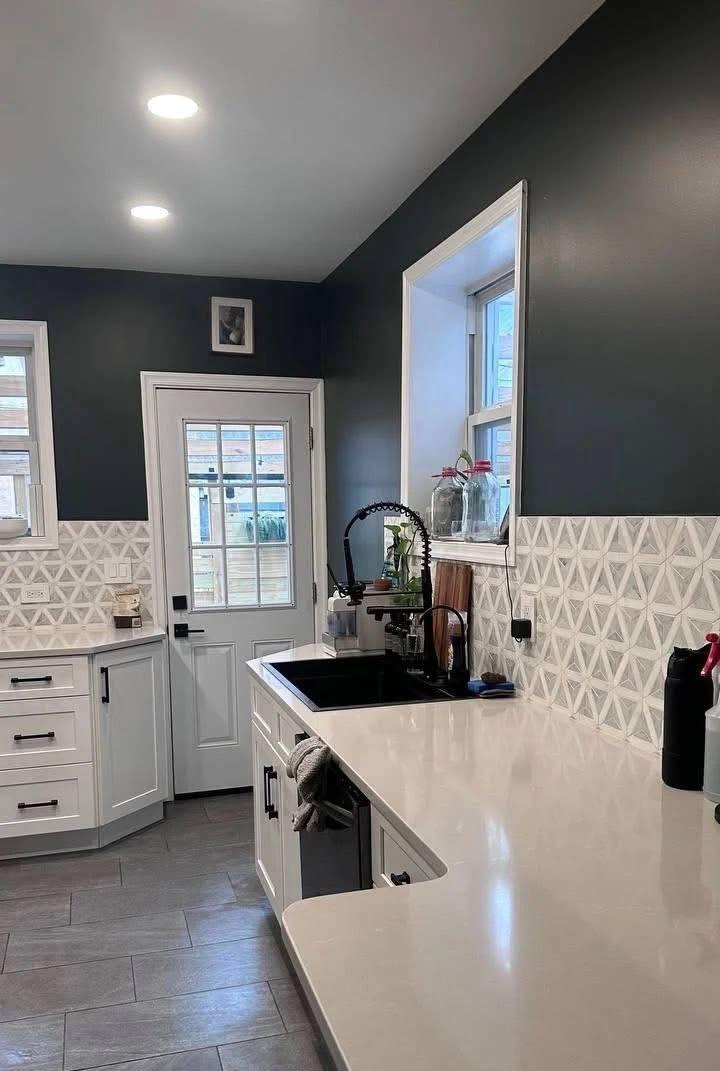 White kitchen cabinets and counters wiped down after a deep clean
