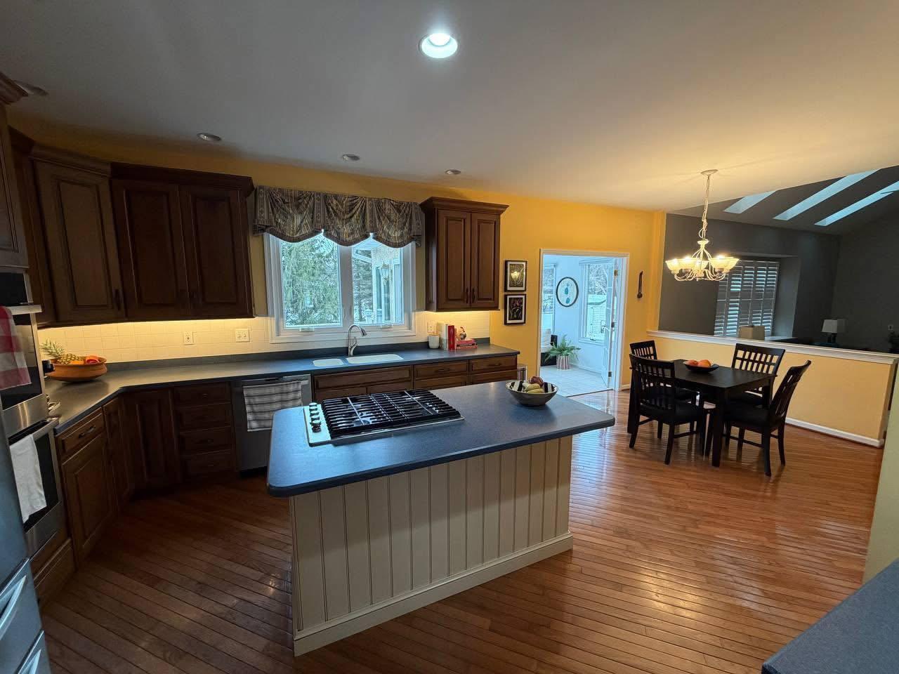 Open kitchen and dining area after a whole-home clean
