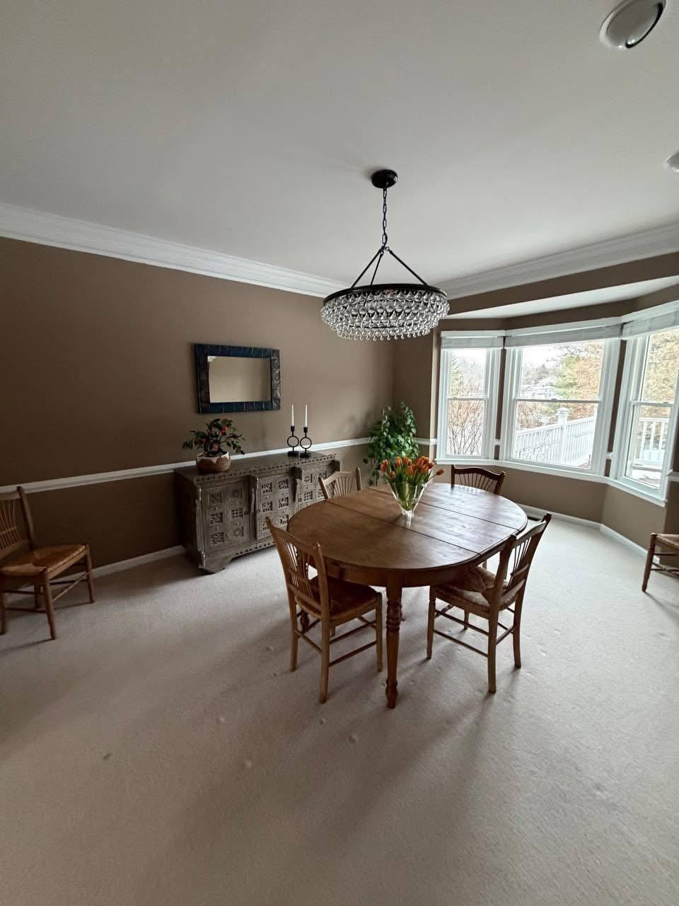 Dining room with bay window, dusted and vacuumed